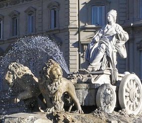 Fountain of Cybele with the Palacio de Linares (House of the Americas headquarters) in the background. Madrid, Spain - After turning Atalanta and Hippomenes into lions, Cybele bridled them, and used them to pull her chariot