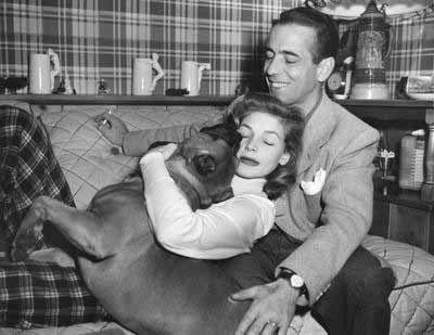 Life is better with dogs! Lauren Bacall and Humphrey Bogart with their boxer.